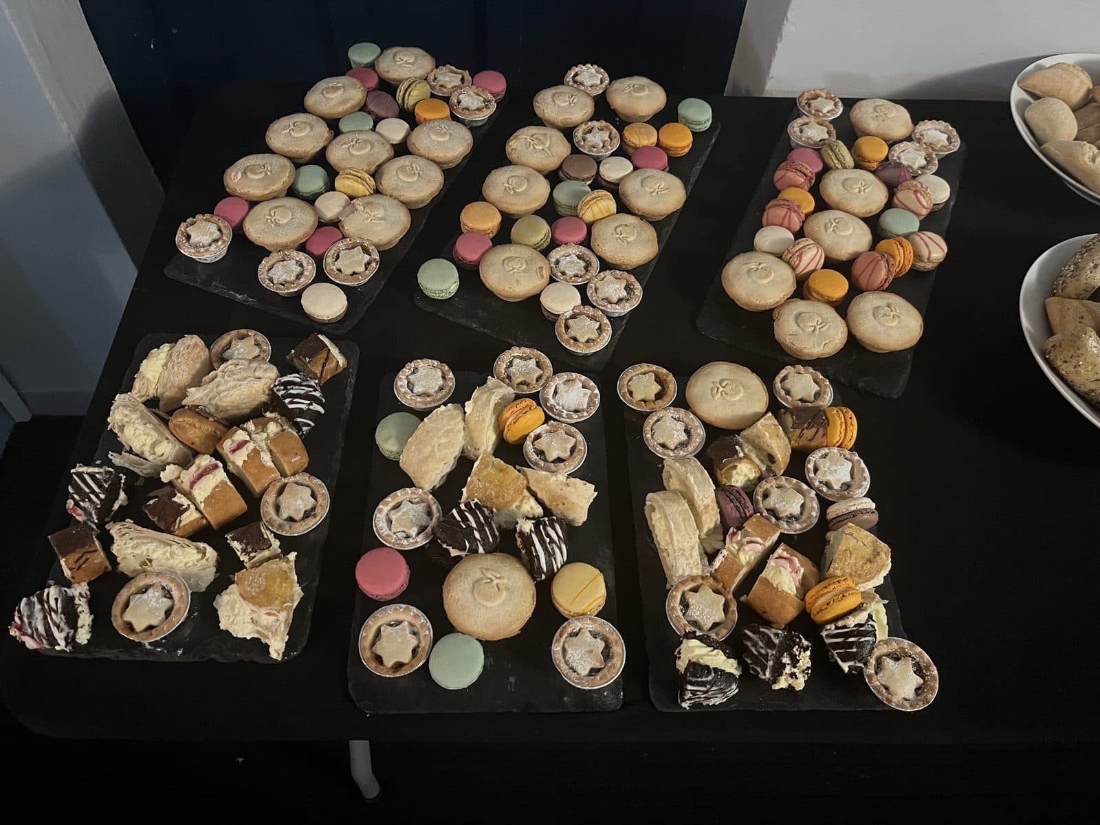Cakes, macarons and mince pies laid out for a party
