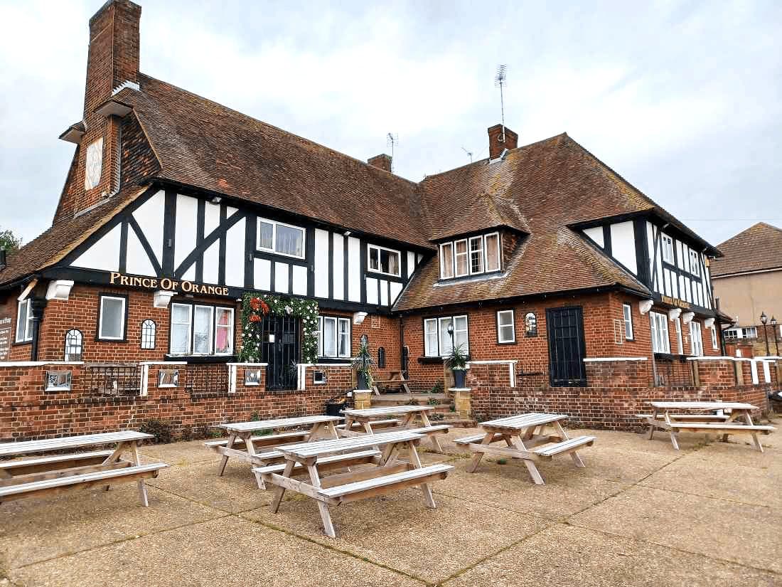 The pub by day, with picnic benches out front