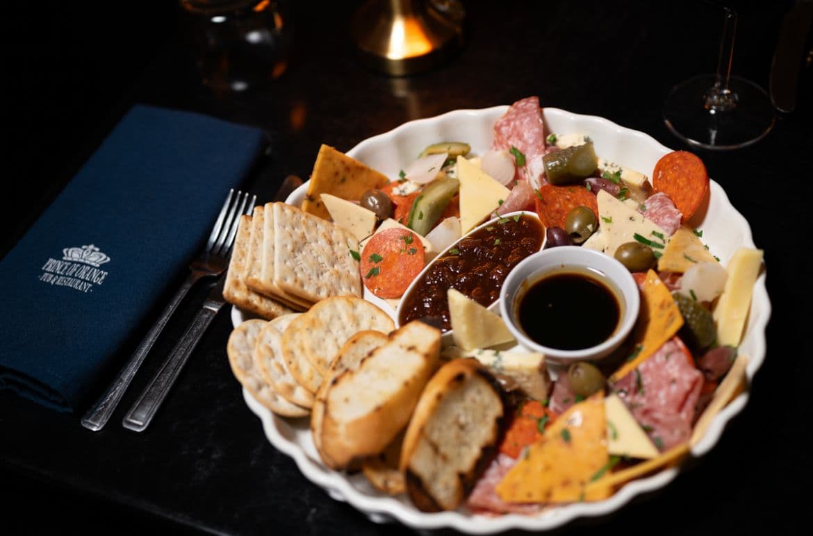 Sharing platter with cured meats, cheese and olives