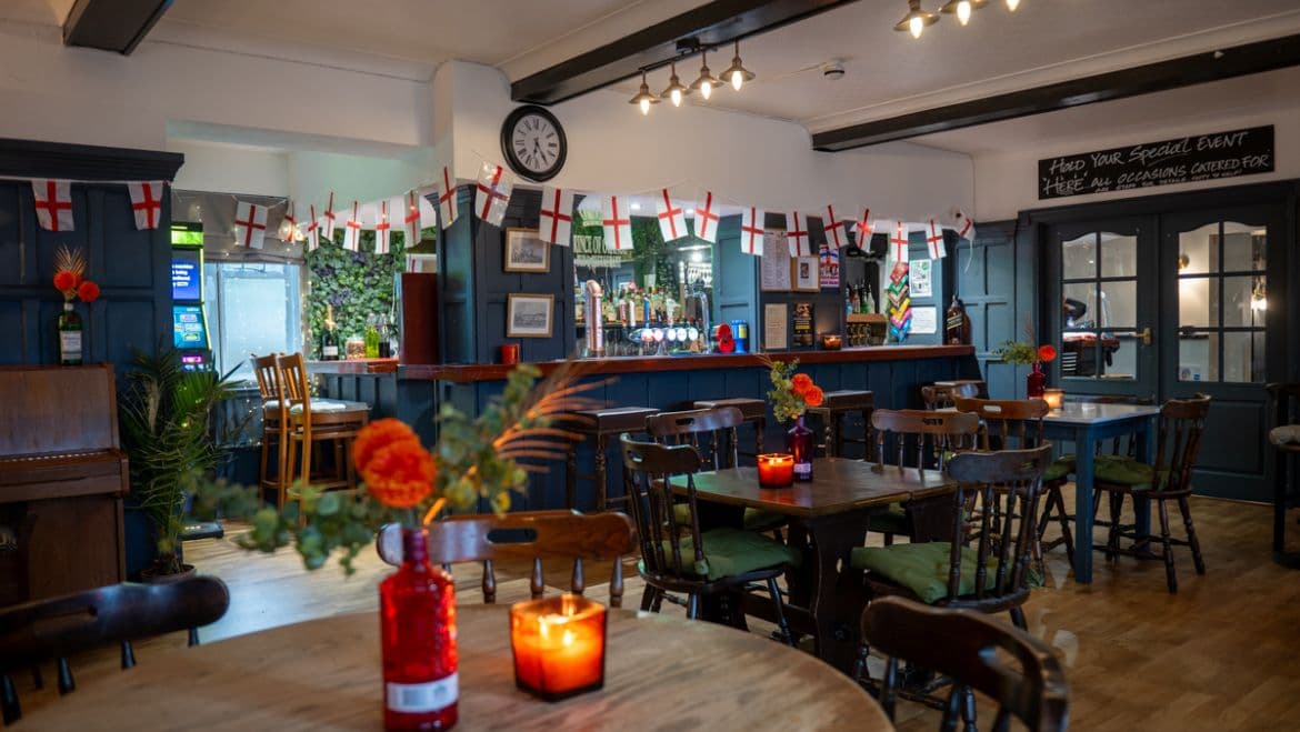 Bar and dining area decorated with England bunting